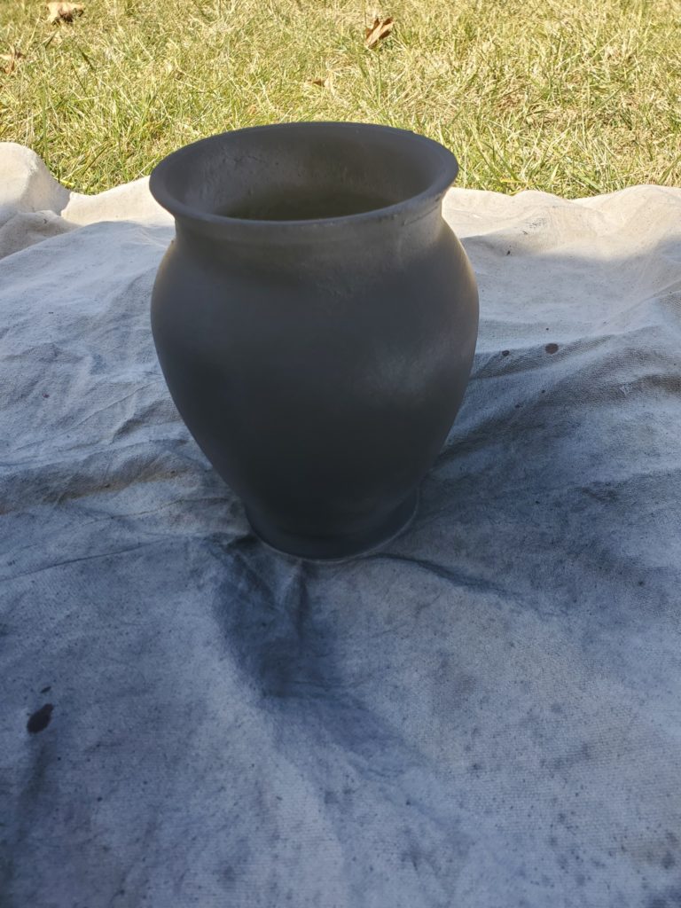 Black spray painted vase